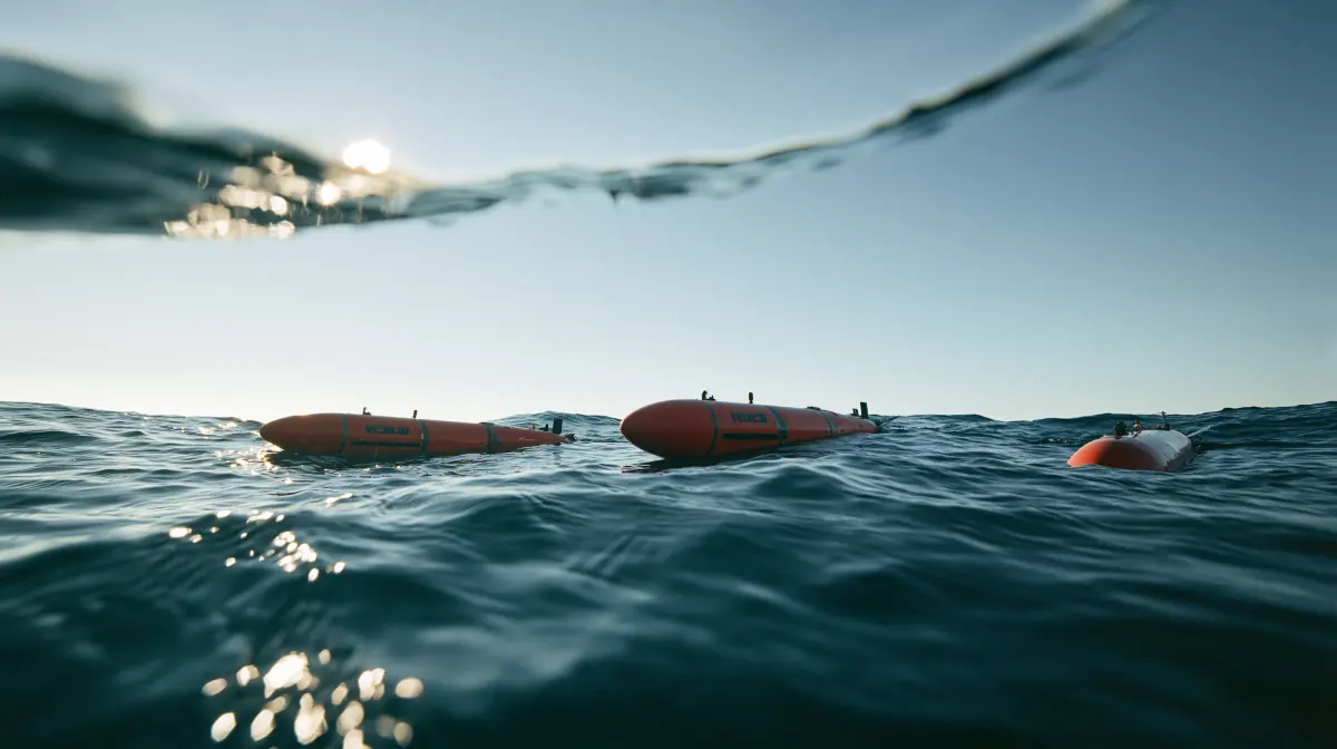 Uncrewed underwater vehicles at the waterline, seen from just below the surface